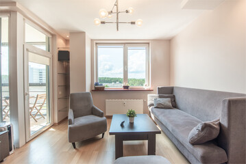 Modern Cozy Living Room with Natural Light and Comfortable Furniture