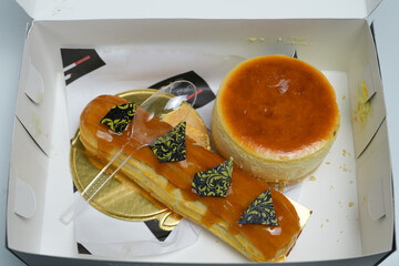 delicious pastries highlighting eclair and cheesecake on white background