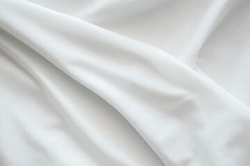 The texture of the bright white fabric is wavy and flowing, the wrinkles of the white stretch...