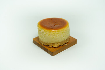 Delicious Mini Cheesecake With Golden Crust on White Background Display