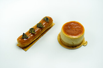 delicious pastries highlighting eclair and cheesecake on white background