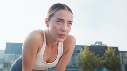 Tired young athlete woman resting after hard training in urban city park. Determined sportswoman jogger takes deep breath looking away. Catching breath, reflects on progress and plans next workout. - Powered by Adobe