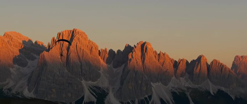 Majestic mountain range sunset paragliding