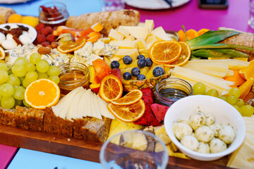 A large fruit platter with exotic berries and fruits.