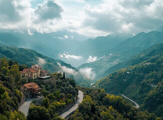 Beautiful, winding asphalt road in the green forest with mountains and clouds in the background, northern Italy. A scenic highway for car travel through the natural landscape of the Alps. Restaurant C