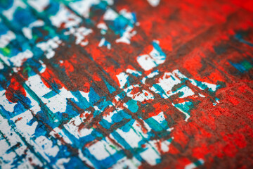 Extreme close up of colorful acrylic paint texture showing brush strokes. Selective focus.