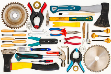 Flat lay of new and used hand tools on white background. Large collection of various tools and bits arranged on white.