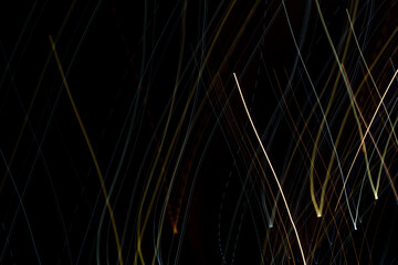 Abstract background with geometric elements and colorful lines on a black background. Copyspace...
