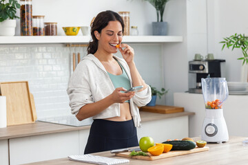 Influencer woman talking about nutrition to her followers while recording with smartphone in the...