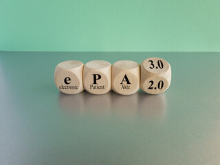 Turned a wooden cube and changes the term ePA 2.0 to ePA 3.0. Symbol for the Electronic Patient Record for all in Germany. Copy space