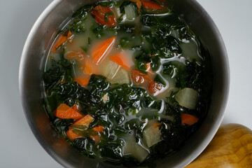 Healthy Vegetable Broth with Carrots, Greens, and Root Vegetables in a Pot