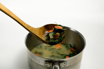 Healthy Vegetable Broth with Carrots, Greens, and Root Vegetables in a Pot