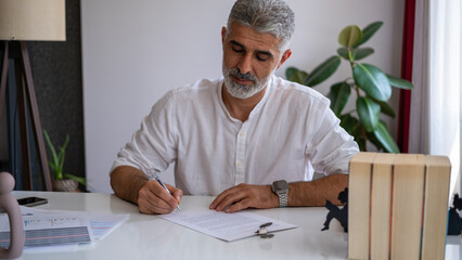 businessman signing agreement in office