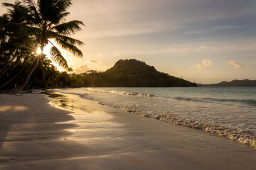 Scenic Anse Volbert beach at sunset in Praslin island, Seychelles