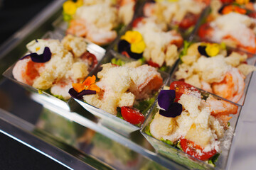 tartlets with pate and salad garnished with flowers. Delicious appetizers.