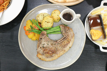 pork steak or grilled pork and salad or pork chop