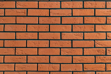 Red brick wall with distinctive black mortar lines