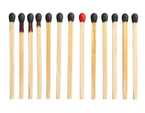 A lineup of wooden matchsticks with one unlit red matchstick standing out among several blackened, burnt matchsticks.