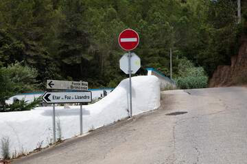 Rural Road Signs in Portugal Near Forested Hills