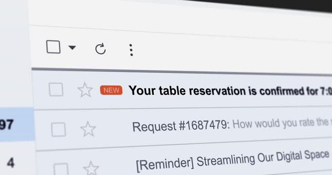 Incoming email with title Your table reservation is confirmed, new e-mail with dinner reservation confirmation email, webmail interface close up footage