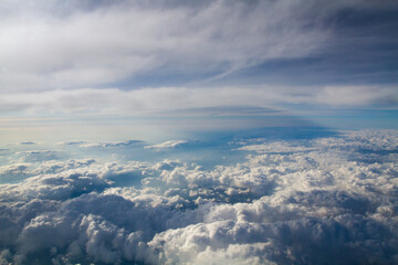 beautiful thick clouds in the sky from the height of the plane