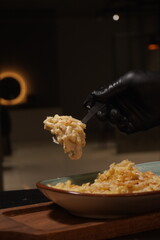 Close up of Creamy cheese pasta with melted cheese topping, appetizing Italian cuisine