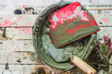 Cement mortar with a tool on the bucket