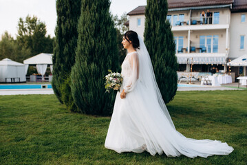 wedding ceremony of a young couple in love on a green meadow
