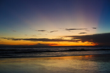 beautiful dramatic landscape of sunset on the sea beach