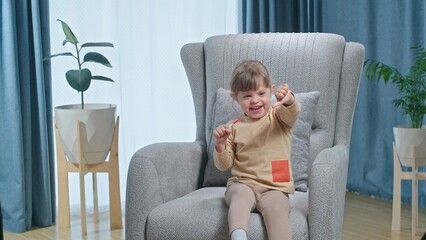 Cute laughing toddler girl liking lolipop and showing like and dislike sighn, concept of healthy...