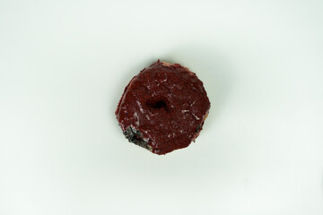 taking single donut in white studio background