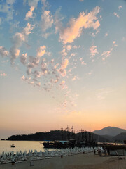 beautiful ships and boats are moored near the shore