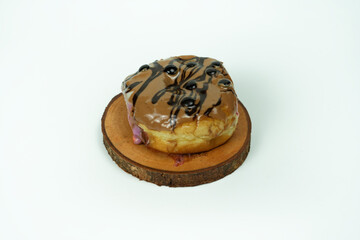 taking single donut in white studio background