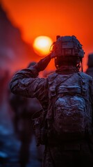 Soldiers salute the setting sun during a chilly sunset in an operational zone