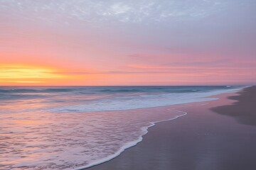 Serene beach at sunrise with pastel pink and orange sky and gentle waves