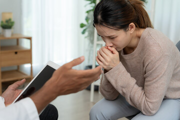 woman with mental health problems is consulting. psychiatrist is recording the patient's condition...