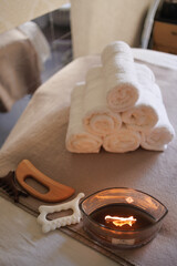 wooden massage tools and towels on massage table