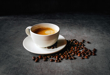 Coffee cup and coffee beans on gray background,  Espresso coffee cup aromatic