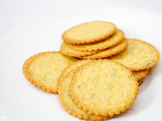 Thin round biscuits crackers stacked together close-up, Sweet and tasty round butter crackers.