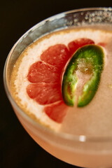 Refreshing grapefruit jalapeño mocktail with a spicy twist in a glass