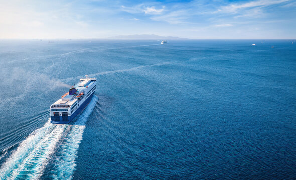 Aerial view of a passenger roll on roll off (RoRo) ship traveling over the Aegean Sea in Greece with copy space