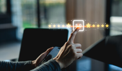 A person is giving a 5-star rating on a digital interface, highlighting excellent user feedback or...
