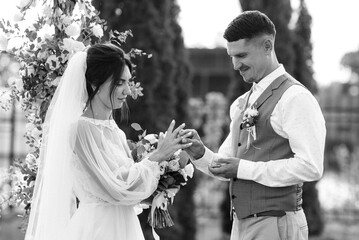 wedding ceremony of a young couple in love on a green meadow
