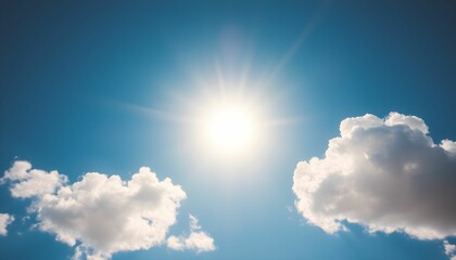 Bright sun shining brightly in a vibrant blue sky with fluffy white clouds.