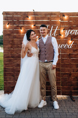wedding ceremony of a young couple in love on a green meadow