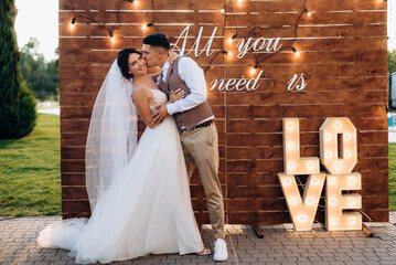 wedding ceremony of a young couple in love on a green meadow