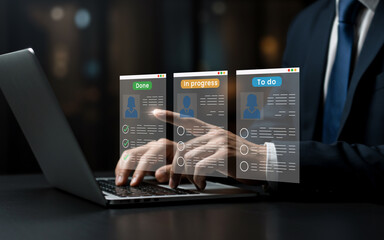 Businessman using laptop to manage tasks on a digital interface