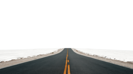 Empty road stretching into the distance, surrounded by snow-covered landscape, clear blue sky.