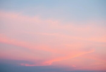 Obraz premium Soft pastel hues blend seamlessly from deep blue to pale peach in a vertical sunset sky, background, sky