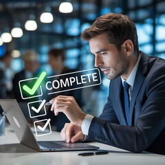 Businessman completing tasks on laptop